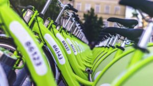 several yellow-green bikes stacked next to each other